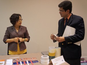 PRTEC Executive Director Francisco Chévere (right) inspects samples brought by a member of the Taiwan business delegation.