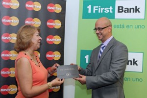 Dolores Santana receives her grand prize from Michael Weiss, vice president of FirstBank credit card services.