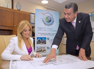 From left: Karen Artau, president and Ángel Álvarez, vice president of operations of Metro Pavia Health System review the blueprints for the planned expansion.