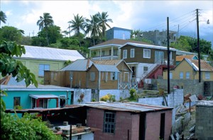 Wood-and-zinc houses crowd a hillside outside Basseterre, capital of the twin-island republic of St. Kitts & Nevis — smallest independent nation in the Western Hemisphere. (Credit: Larry Luxner)