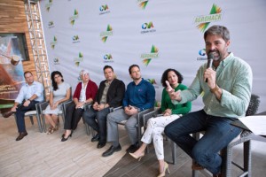 Agrohack event producer Carlos Cobián discusses details of the upcoming event, flanked by a group of collaborators.