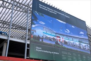 Billboard shows off future vision of Kingston's Norman Manley International Airport. (Credit: Larry Luxner)