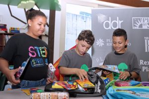 Boys & Girls club participants check out the back-to-school supplies.