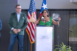 From left: Jorge Pérez and Maripily Rivera display the permitted handbag sizes for entry into the venues starting March 29.