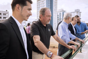Rolando Padua, left, and John Paulson, second to last on the right, with members of the Vanderbilt Residences development team during a site visit.