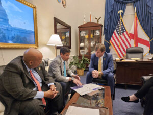 Puerto Rico Chamber of Commerce President Luis Pizarro (center) meets with U.S. Rep. Dale Strong (right), chairman of the FEMA Subcommittee.