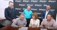 From left, standing: Juan Carlos Agosto, CEO of Store Management System LLC; Javier Agosto, owner of Oiremoc LLC; and Leonardo Maldonado, relationship manager at Banesco USA. Seated: Juan Agosto and Efigenio Rivera, co-owners of Store Management System; and Maritza Abadía, president of Banesco USA in Puerto Rico, during the closing of the $9 million loan for the Sierra Bayamón Econo supermarket renovation.
