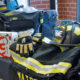 The donation includes 10 full sets of bunker gear, each with a helmet, gloves, boots, pants, jacket and flashlight with carrying bag.