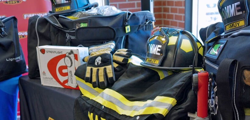 The donation includes 10 full sets of bunker gear, each with a helmet, gloves, boots, pants, jacket and flashlight with carrying bag.