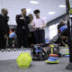 Caguas Mayor William Miranda-Torres watches a student operate a remote-controlled robot during the opening of the LIFT Learning Lab.