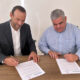 From left, Dominican Franchise Association President Oscar Luis Monzón and Puerto Rico Franchise Association President Ricardo L. Rivera sign a collaboration agreement in Santo Domingo to promote investment and franchise sector growth in the Caribbean.