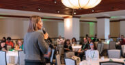 Brenda Irizarry of FirstBank leads a coaching habits training during a recent 1Éxito for Business event.