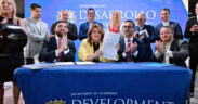 Gov. Jenniffer González, center, signs Puerto Rico’s new permitting reform alongside Sebastián Negrón-Reichard, secretary of the Department of Economic Development and Commerce, and private sector leaders.