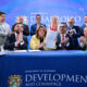 Gov. Jenniffer González, center, signs Puerto Rico’s new permitting reform alongside Sebastián Negrón-Reichard, secretary of the Department of Economic Development and Commerce, and private sector leaders.