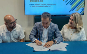 From left, Brian Miller of Business Innovation Group, San Juan Mayor Miguel Romero and Daphne Barbeito attend the signing ceremony approving new economic development decrees in San Juan.