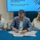 From left, Brian Miller of Business Innovation Group, San Juan Mayor Miguel Romero and Daphne Barbeito attend the signing ceremony approving new economic development decrees in San Juan.