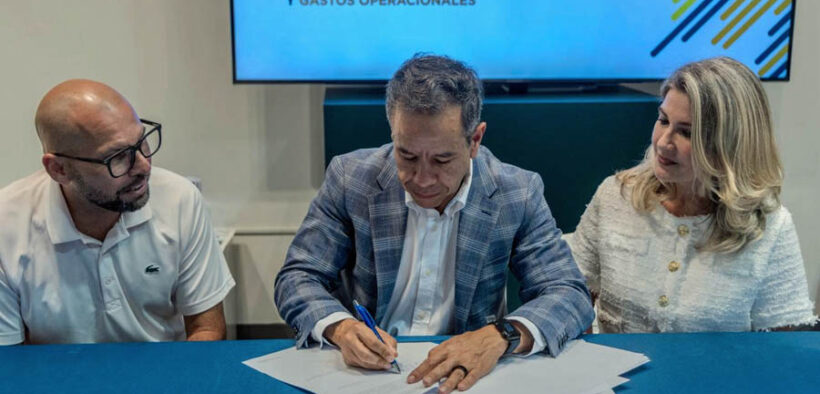 From left, Brian Miller of Business Innovation Group, San Juan Mayor Miguel Romero and Daphne Barbeito attend the signing ceremony approving new economic development decrees in San Juan.