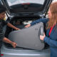 Student Jarel Negrón receives a Yamaha tuba donated by Mitsubishi from Madelene Nieves, vice president of Mitsubishi Motor Sales of Caribbean.