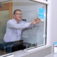 Thomas Seewoester, vice president of operations for Amgen Puerto Rico, places the Energy Star certification label at the company’s Juncos facility.