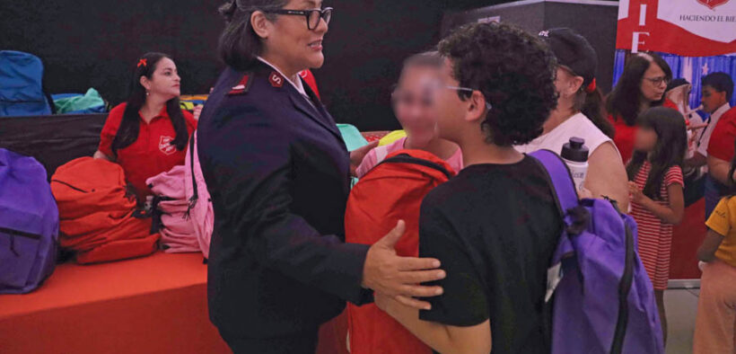 Bersabé Vera, divisional commander for The Salvation Army in Puerto Rico and the U.S. Virgin Islands, greets children during the annual “Back to School” event in Bayamón.