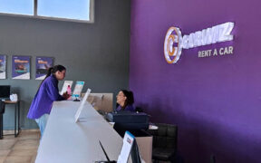 Staff assist customers at the new Carwiz Rent a Car location on Isla Verde Avenue in Carolina. (Credit: Carwiz Rent a Car's Facebook page.)