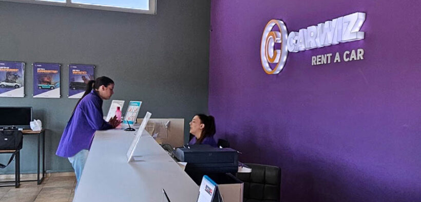 Staff assist customers at the new Carwiz Rent a Car location on Isla Verde Avenue in Carolina. (Credit: Carwiz Rent a Car's Facebook page.)