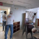 Volunteers move furniture donated by St. John's school.