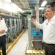 From left, Chuck Page, Liberty vice president of technical operations, and Víctor Vera, engineering director for Puerto Rico and the U.S. Virgin Islands, stand in front of backup batteries at the company’s core platform site in San Juan.