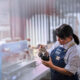 A worker pours steamed milk at Indulac’s facility in Puerto Rico, where the cooperative produces shelf-stable dairy products for local and export markets.