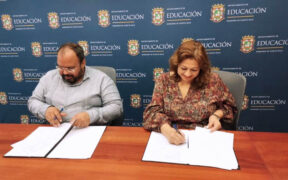 From left: Education Secretary Eliezer Ramos-Parés and One Stop Career Center Executive Director Carmen Cosme-Pitre at the signing of a renewed agreement to support aviation industry training in Puerto Rico.