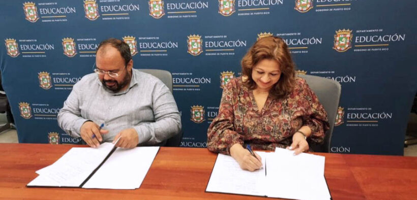 From left: Education Secretary Eliezer Ramos-Parés and One Stop Career Center Executive Director Carmen Cosme-Pitre at the signing of a renewed agreement to support aviation industry training in Puerto Rico.