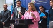 Gov. Jenniffer González announces new medical manufacturing investments, joined by DDEC Secretary Sebastián Negrón-Reichard (left) and other officials.
