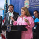 Gov. Jenniffer González announces new medical manufacturing investments, joined by DDEC Secretary Sebastián Negrón-Reichard (left) and other officials.