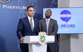 Treasury Secretary Ángel Pantojas, left, speaks during a government briefing at La Fortaleza.