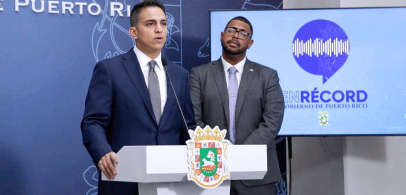 Treasury Secretary Ángel Pantojas, left, speaks during a government briefing at La Fortaleza.
