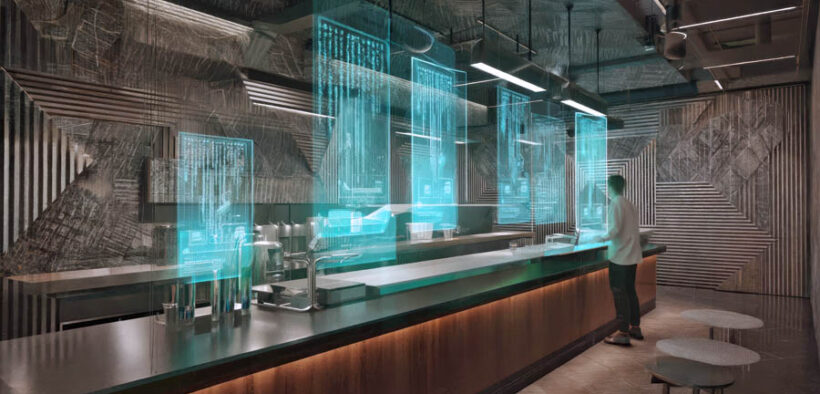 A bartender manages a futuristic bar using a holographic interface to streamline service in a modern, technology-driven establishment. (Credit: Justlight | Dreamstime.com)