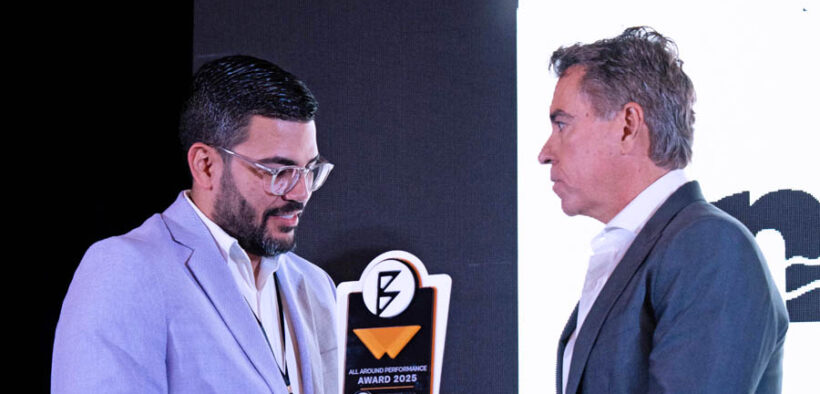 Orlando Bravo, right, co-founder of the Bravo Family Foundation, presents the All-Around Performance Award to Obeth Seguinot of Mikokos during REP Day 2025.