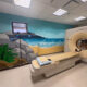 A coastal-themed mural with blue tones, rocks and plants was painted in the Imaging Center at Puerto Rico Children’s Hospital in Bayamón to create a calming environment for pediatric patients.