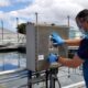 An employee operates equipment at the Los Filtros water plant in Guaynabo, a facility Gov. Jenniffer González says must be replaced as part of a $10 million emergency plan to address water service outages. (Credit: Puerto Rico Aqueduct & Sewer Authority)