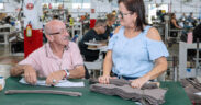 Brightforce employees work on uniform and equipment production at the company’s Mayagüez plant.