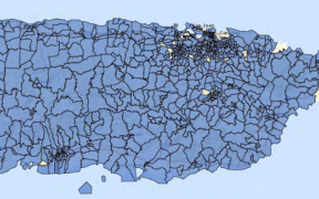 A map of Puerto Rico’s census tracts in federal Opportunity Zones, shaded blue, which cover about 98% of the island. Yellow areas are not designated. (Credit: Puerto Rico Department of Economic Development and Commerce)