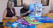 From left: Coral Cummings, director of government relations and public affairs for Walmart Puerto Rico, and artist Waldemar Lozada.