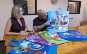 From left: Coral Cummings, director of government relations and public affairs for Walmart Puerto Rico, and artist Waldemar Lozada.