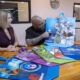 From left: Coral Cummings, director of government relations and public affairs for Walmart Puerto Rico, and artist Waldemar Lozada.