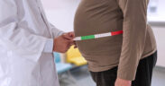 A physician measures a patient’s waistline as rising obesity rates in Puerto Rico drive higher cancer risks and add strain on the health care system. (Credit: Jean Paul Chassenet | Dreamstime.com)