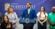 Transportation and Public Works Secretary Edwin González speaks at a press conference at La Fortaleza as Gov. Jenniffer González looks on to his left during the announcement of new government payment systems in San Juan.