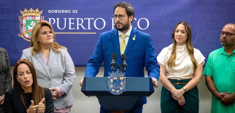 Transportation and Public Works Secretary Edwin González speaks at a press conference at La Fortaleza as Gov. Jenniffer González looks on to his left during the announcement of new government payment systems in San Juan.