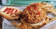 At El Mercadito de Luly in Hato Rey, the frita cubana — a seasoned Cuban-style burger topped with crispy shoestring potatoes — is the restaurant’s signature dish.
