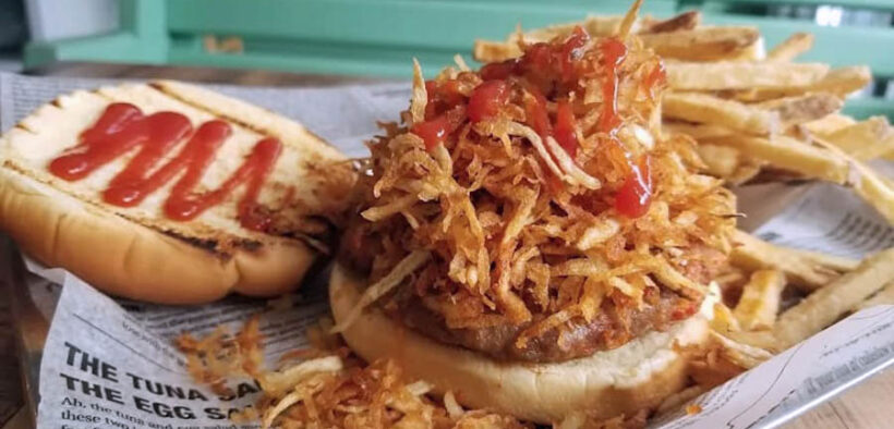 At El Mercadito de Luly in Hato Rey, the frita cubana — a seasoned Cuban-style burger topped with crispy shoestring potatoes — is the restaurant’s signature dish.