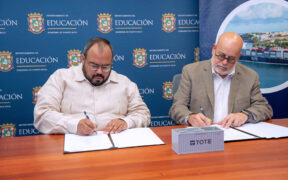 Puerto Rico Education Secretary Eliezer Ramos-Parés and Eduardo Pagán, TOTE’s vice president of corporate affairs, sign an agreement to expand maritime career opportunities for students.